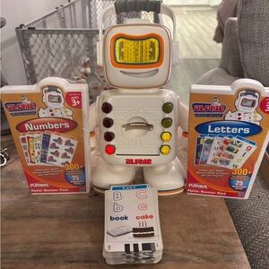 Alphie‎ the interactive learning robot- comes with all of the games and cards